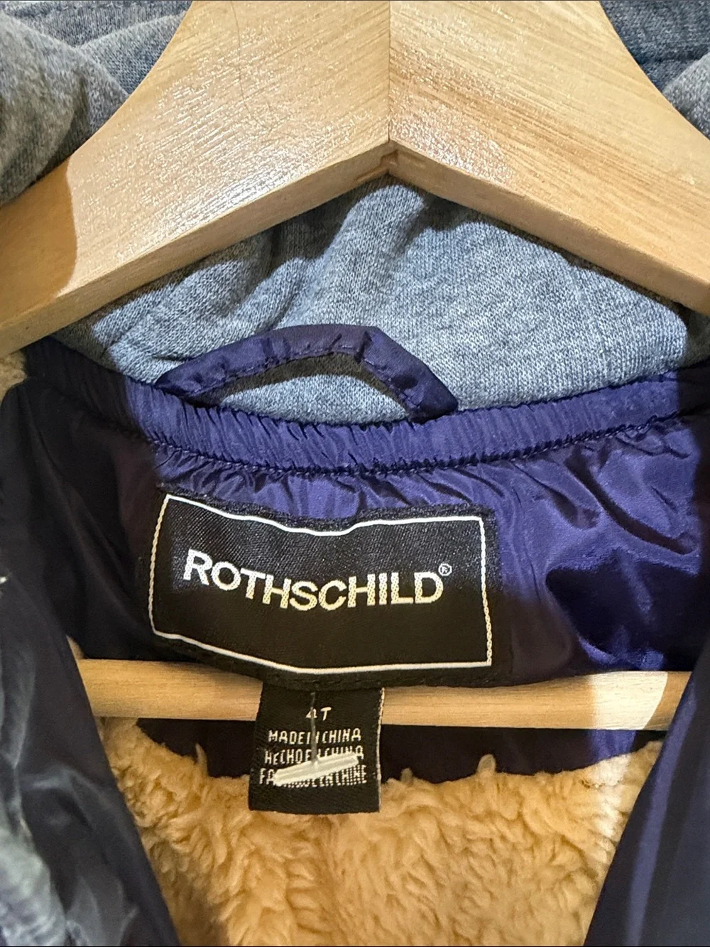 Rothschild Kids varsity puffer jacket features a navy blue puffer body 4T